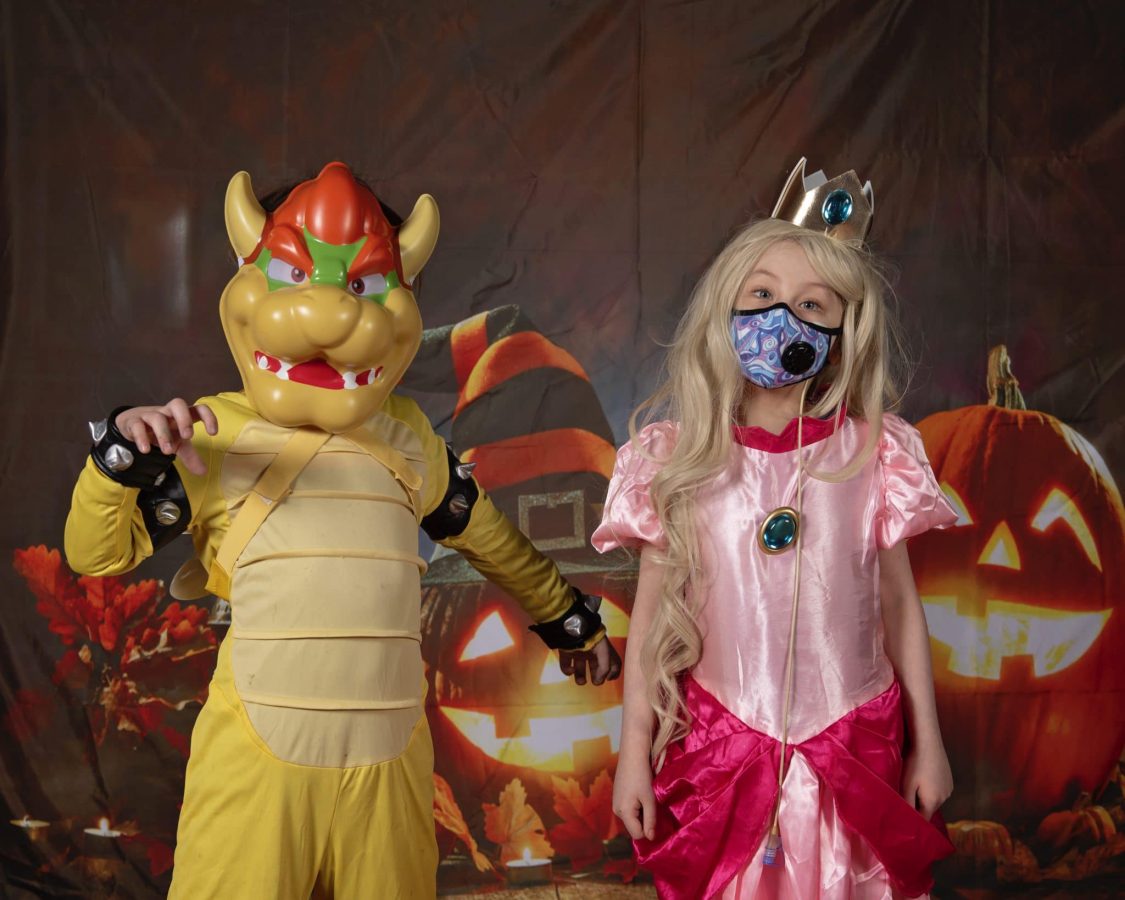 Image from Halloween in our House - Two kids in a dragon and princess costumes