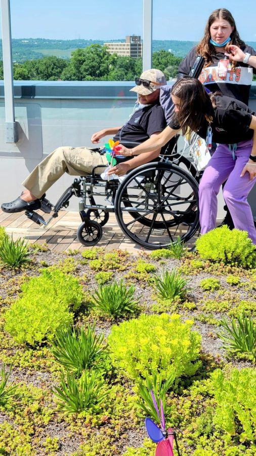 Image from Matthew's Moment - A picture of Matthew outside with two women