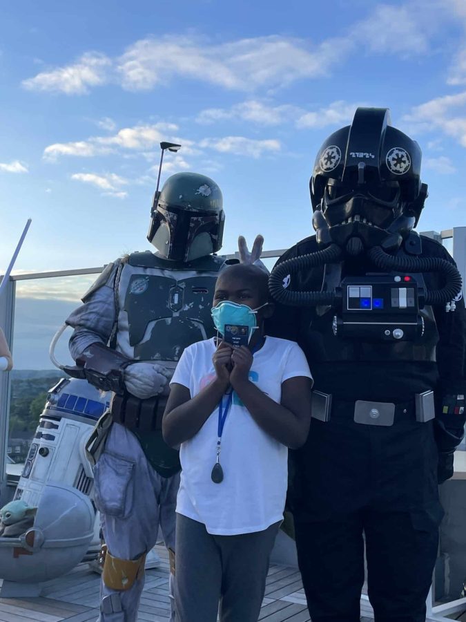 Image from Moments of Joy - A kid with people in Star Wars costume