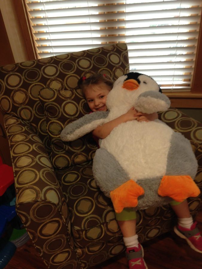 Image of Waylon sister with her huge stuff toy