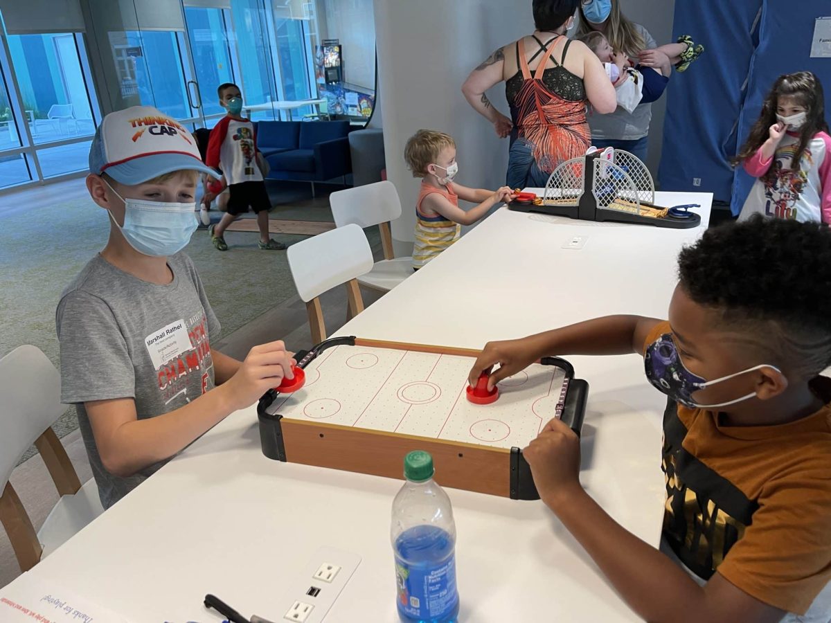 Image from Family Fun Nights - Two kids playing air hockey