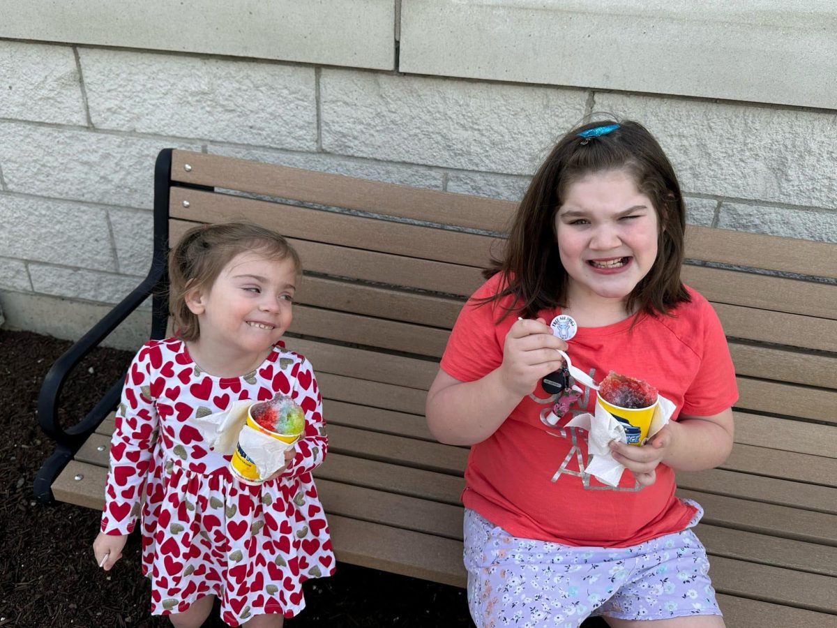 Image from Programs they love - Two girls eating kona ice