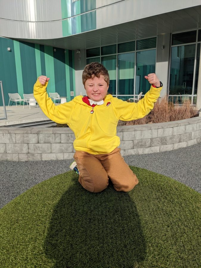 Image of Ash in a yellow jacket