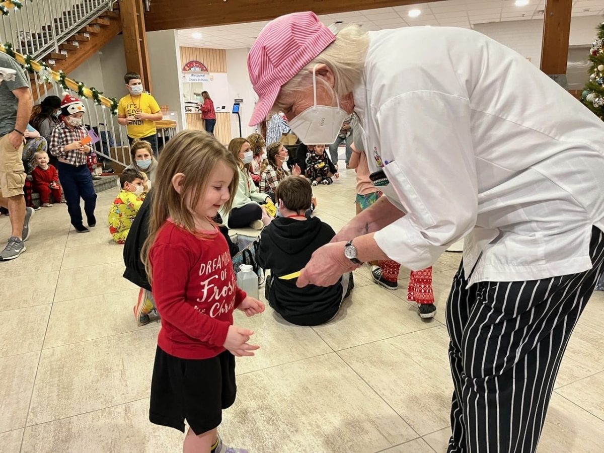 Image from Comfort and Joy - Giving tickets to a kid