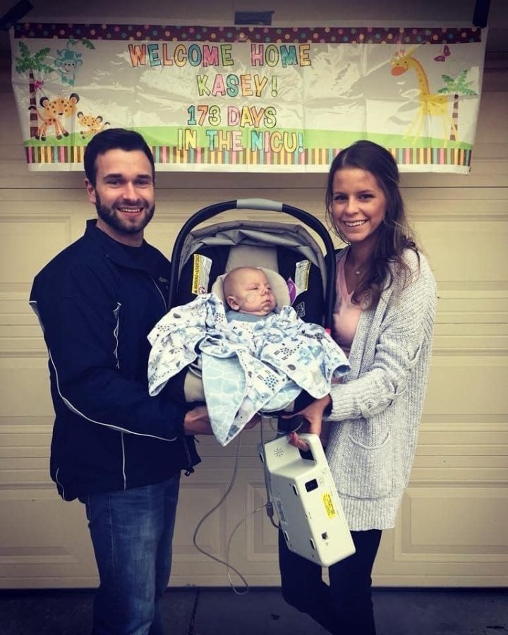 Image of Kasey - Welcome Home Kasey with his parents